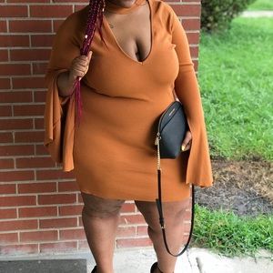 burnt orange flow sleeve dress.